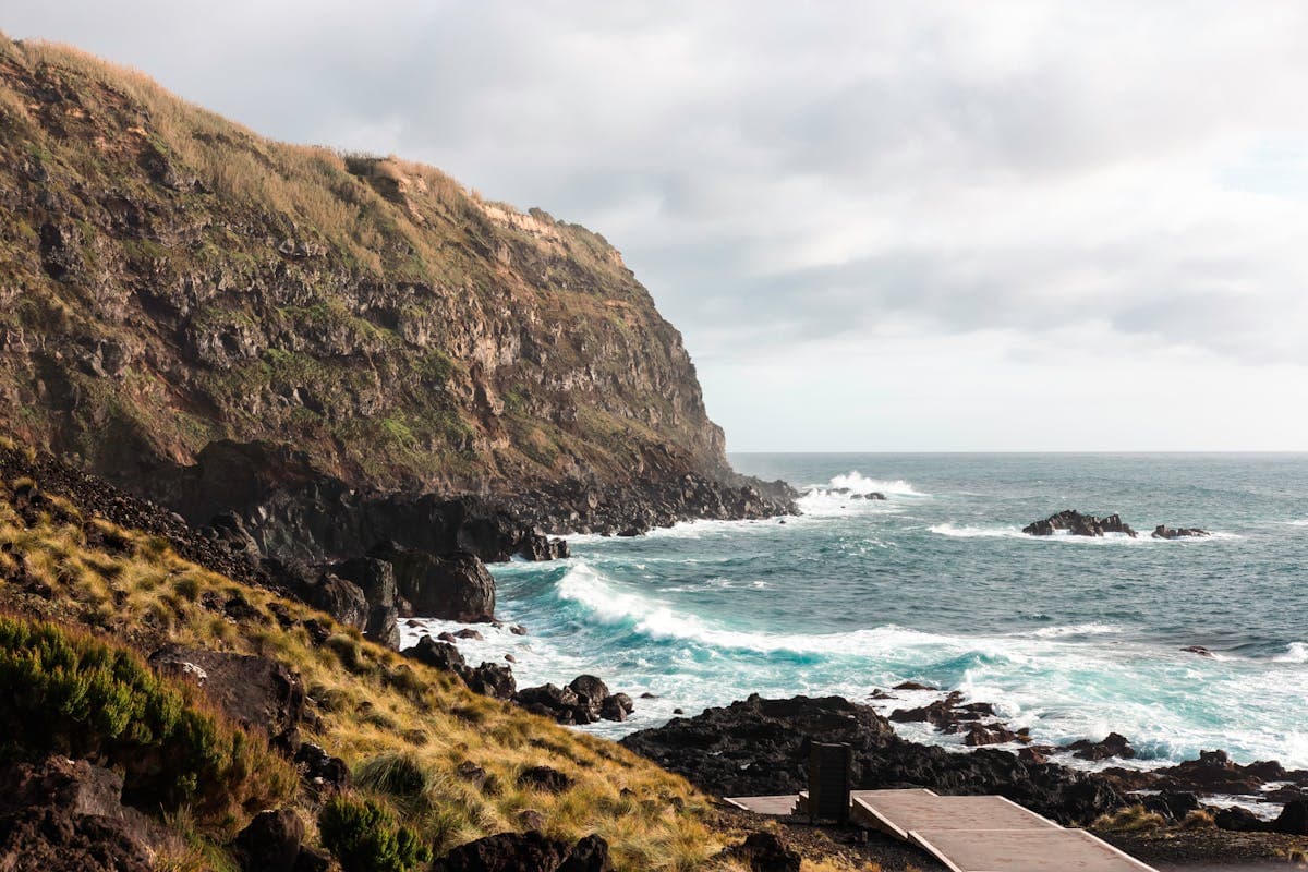 Rocky cliffs of the Azores islands with Atlantic waves crashing against the shore, near where Mary Celeste was found adrift