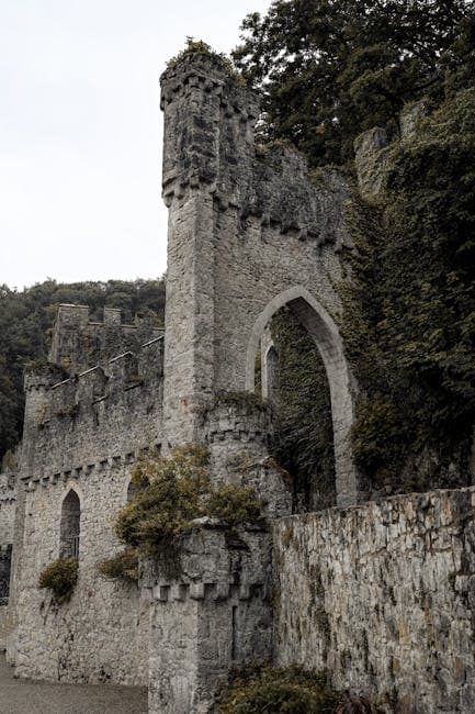 Ancient stone fortress wall with arched entry, evoking the limestone construction of Coral Castle