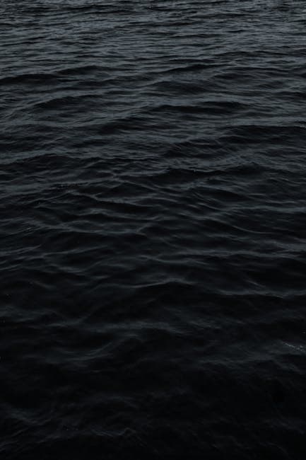 Dark moody ocean surface at dusk, evoking the mysterious atmosphere surrounding unexplained deep-sea discoveries