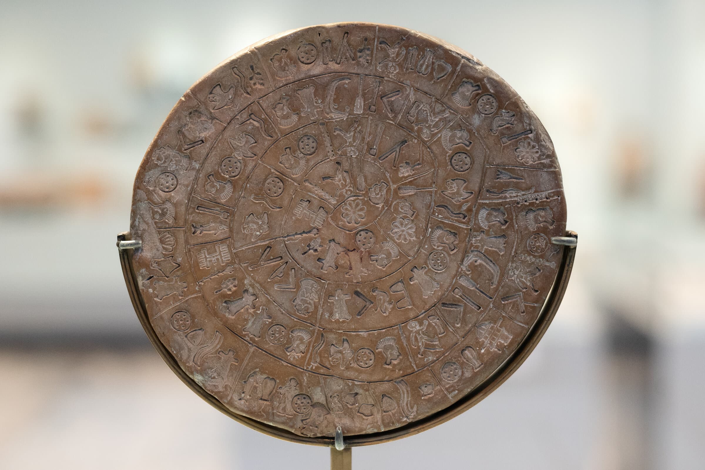 Side A of the Phaistos Disc, a fired clay disc covered in a spiral of stamped pictorial signs